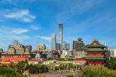 Panoramic view of the city of Beijing, featuring the historic Zhengyangmen Gate and the modern Citic Tower