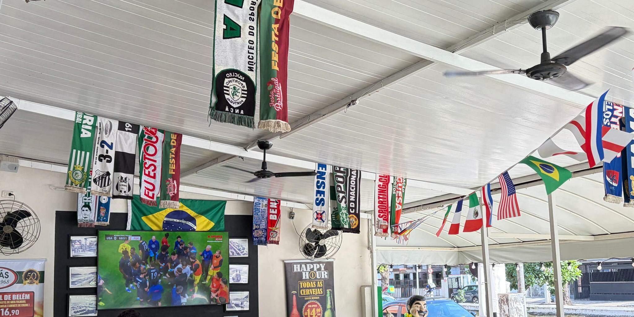 Decoração temática mal aparece nos estabelecimentos. Será reforçada mais perto da estreia da Seleção