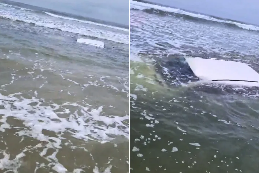 A caminhonete ficou praticamente submersa no mar da Praia de Boraceia, em Bertioga