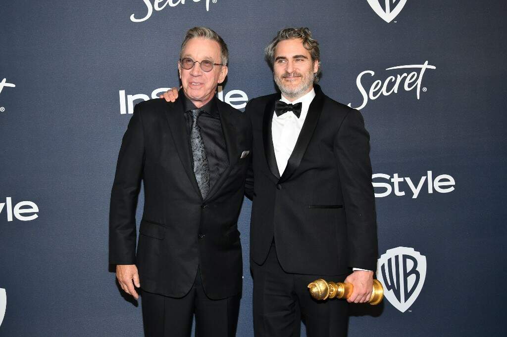 Tim Allen e Joaquin Phoenix durante a premiação 